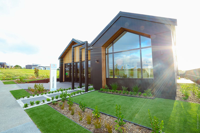 front of showhome clad in cedar and black axon panel