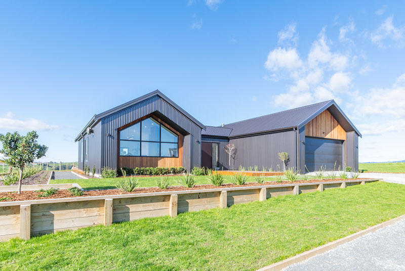 Beauitful award winning pavillion style home in Franklin clad in Cedar and Axon panel by James Hardie