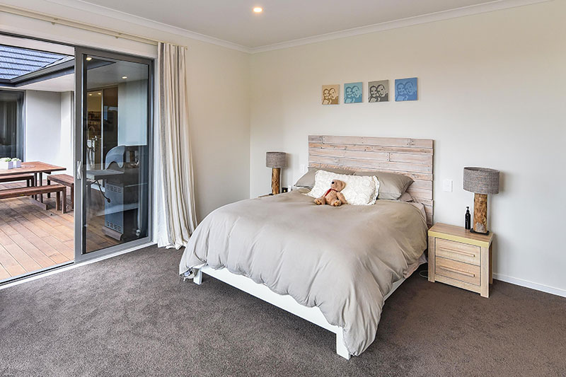 large scandinavian style master bedroom with rustic whitewashed pallet headboard