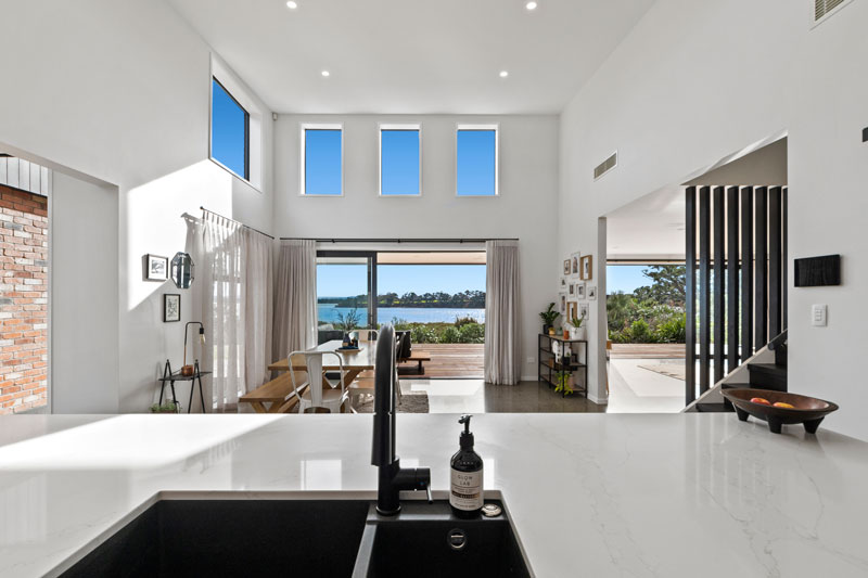 view from kitchen through to living space in designer home in Franklin