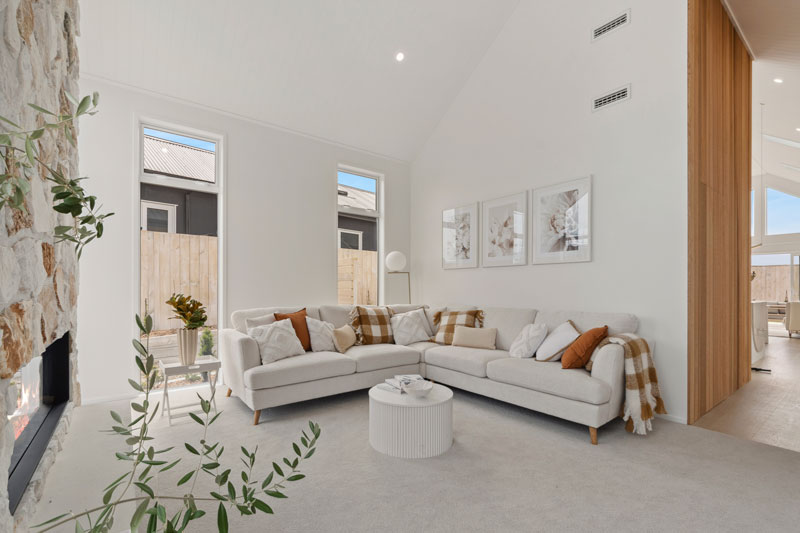 Gorgeous Med inspired home Irregular Stone Vintage white fireplace, cedar pannelled wall, Precision homes showhome