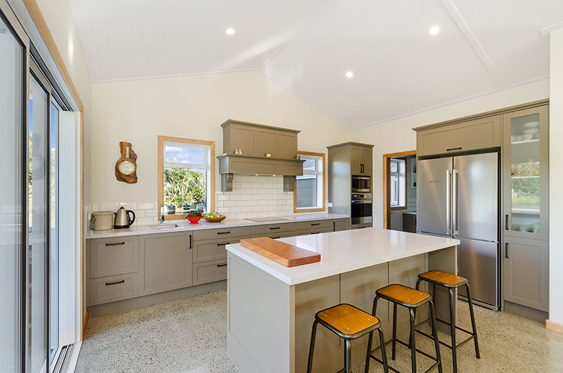 Traditional style kitchen at Award winning colonial home. Olive green traditional cabinets with timber accents