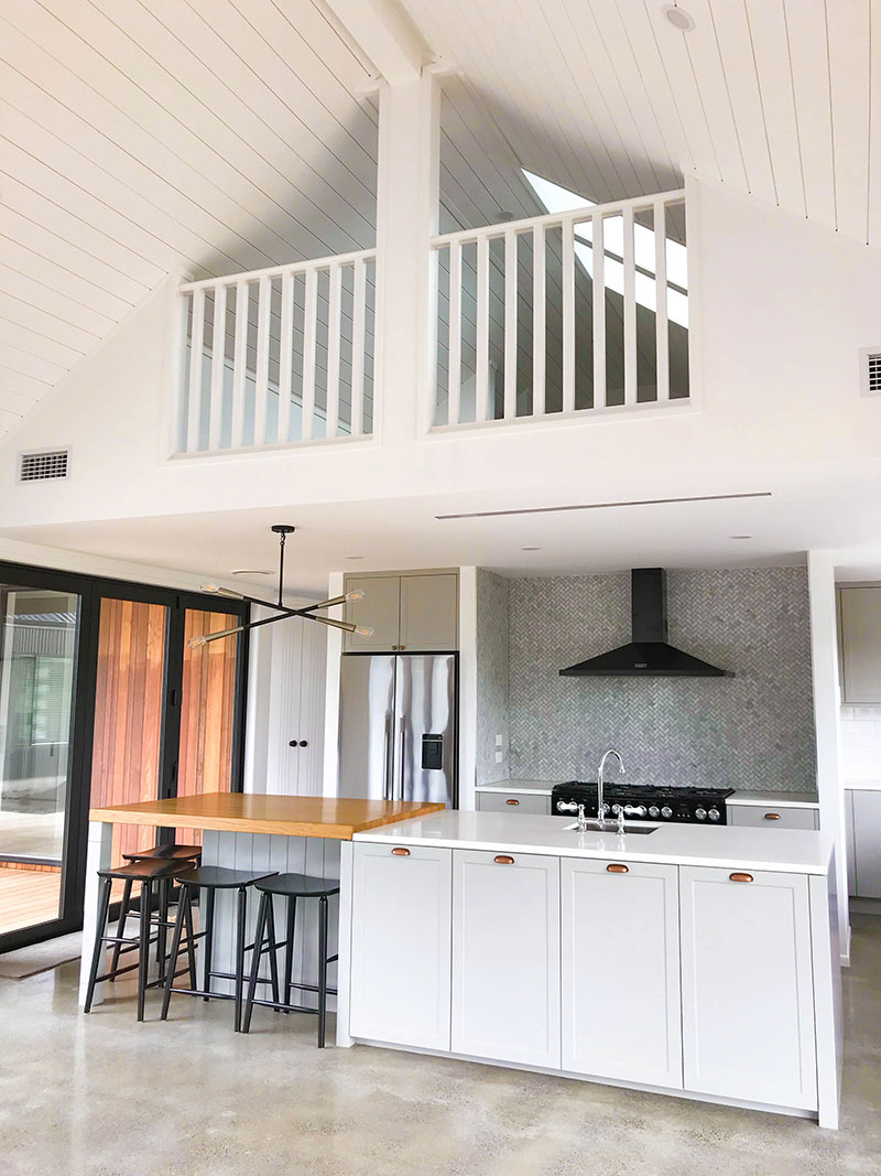 Modern and traditional style kitchen in new barn style home with hidden upstairs nook for kids playroom