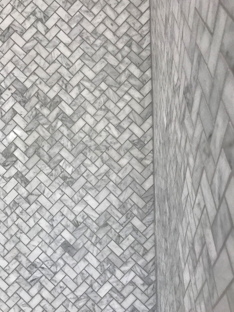 Stunning Herringbone, marble mosaic tiles used as a splash back